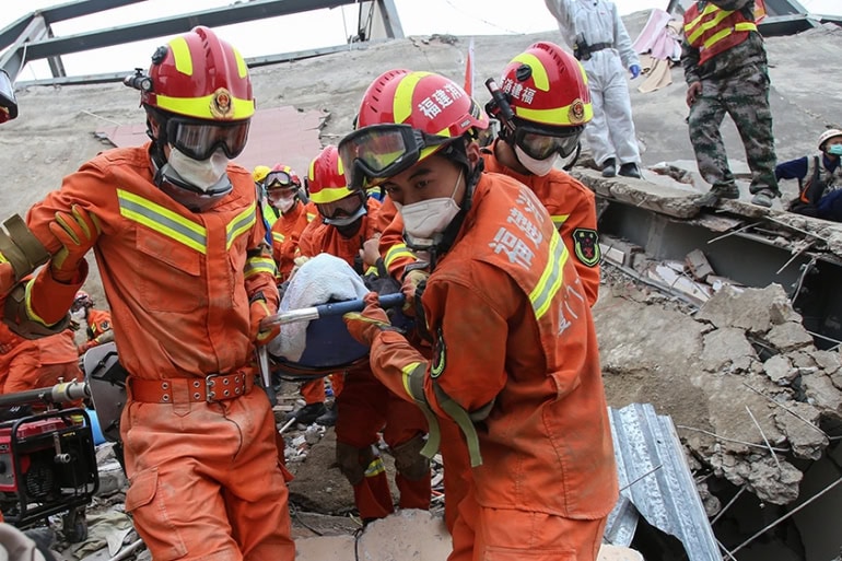 China: Rescue teams pull 7 people from rubble of collapsed hotel