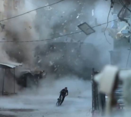 Palestinian Cyclist Narrowly Escapes Israeli Airstrike Debris In Viral Video From Gaza